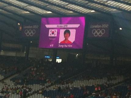 This mobile phone photo provided by James Crossan, shows a mistakenly displayed South Korean flag on a jumbo screen instead of North Korea's, before a women's soccer match which prompted the North Koreans to refuse to take the field for nearly an hour on Wednesday, July 25, 2012, in Glasgow, Scotland. 