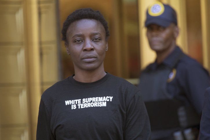 Therese Patricia Okoumou leaves Federal court, Thursday, July 5, 2018, in New York. Okoumou pleaded not guilty Thursday to misdemeanor trespassing and disorderly conduct for climbing the base of the Statue of Liberty on a busy Fourth of July in what prosecutors called a "dangerous stunt." (AP Photo/Mary Altaffer)