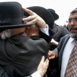 Two Ultra Orthodox hugging during the celebration outside the Supreme Court of Jerusalem. Hundreds of Ultra Orthodox Jewish celebrating outside the Supreme Court, Sunday June 27 2010, after having greeted the parents of Emmanuel, who were released as decided by the Supreme Court of Jerusalem. Photo by Yossi Zamir/Flash90.