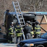 Emergency personnel works on the scene of the deadly bus crash in the Bronx, New York, New York, USA, 12 March 2011. Officials said at least 14 people died and another 20 were hospitalized in an early morning crash on a tour bus returning from Mohegan Sun Casino to the Chinatown section of New York. EPA/ANDREW GOMBERT