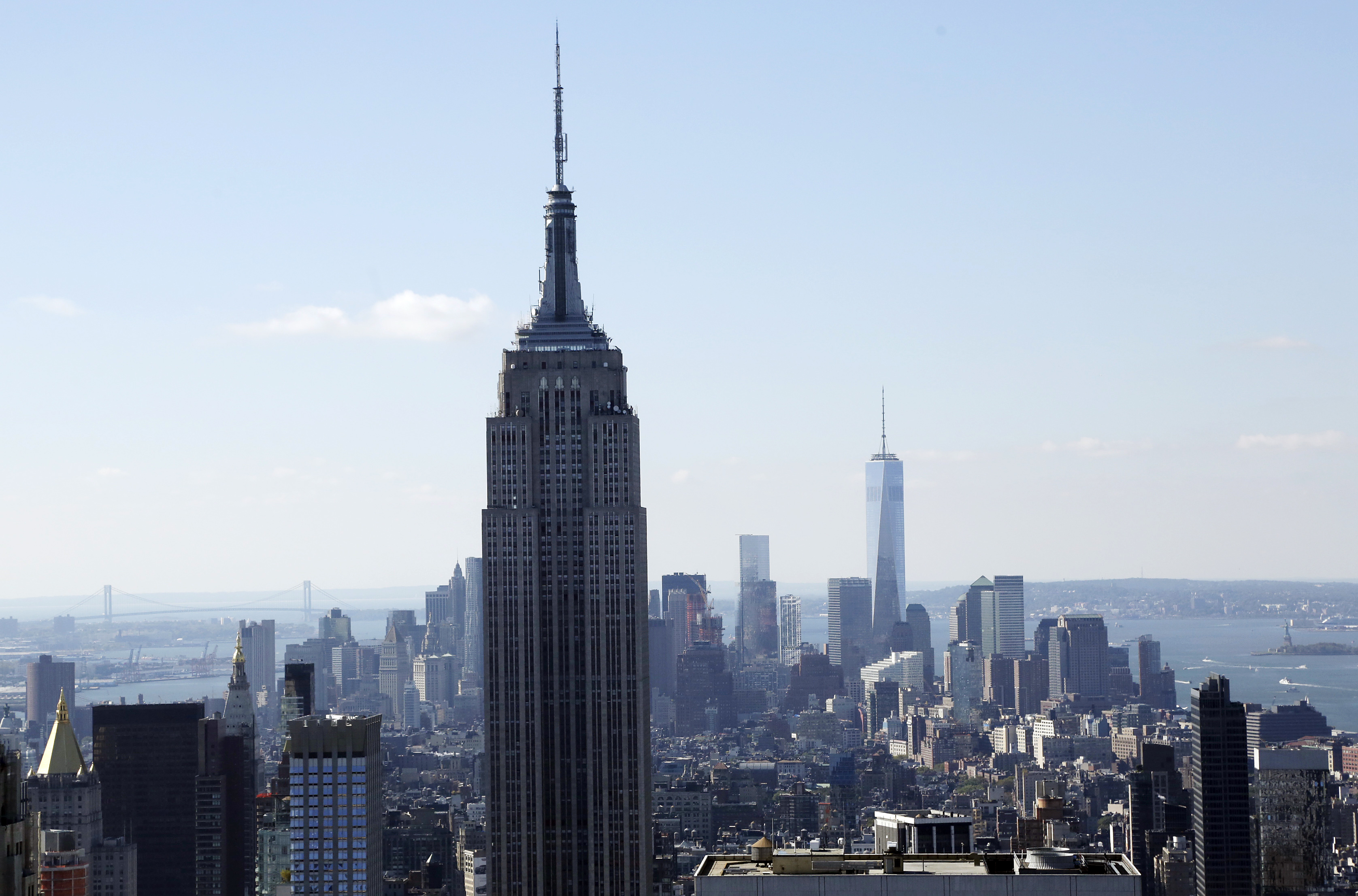 FILE - The Empire State Building and the Manhattan skyline are seen from the Rainbow Room, New York Citys landmark restaurant atop 30 Rockefeller Plaza, in this Sunday, Oct. 5, 2014 file photo. Hundreds of people will take to the stairs at the Empire State Building on Wednesday night Feb. 4, 2015, climbing from the lobby to the 86th floor observatory. They'll be going up the 1,576 steps as part of the 38th annual Empire State Building Run-Up. (AP Photo/Mark Lennihan, File)