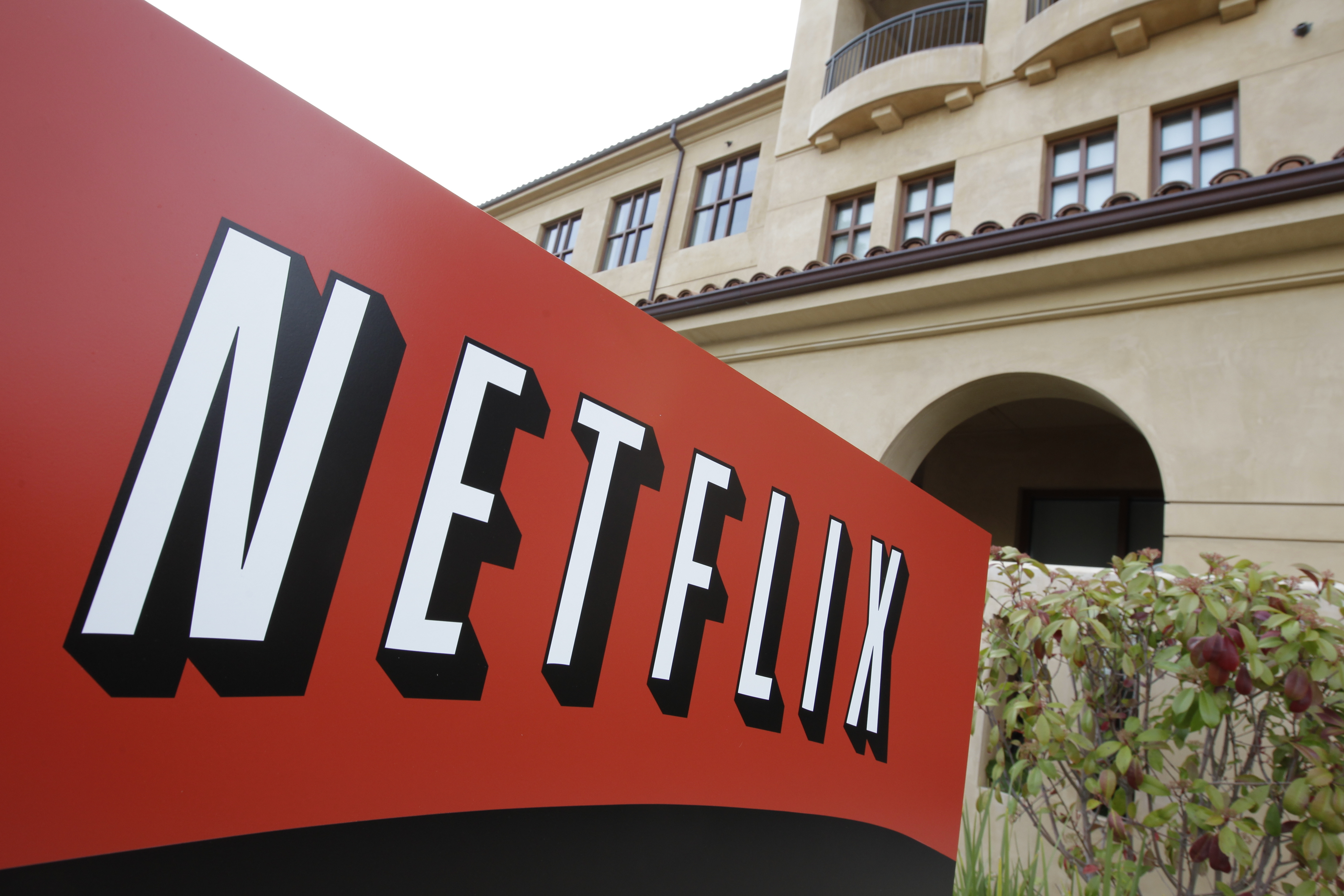 FILE - This March 20, 2012 file photo shows Netfilx headquarters in Los Gatos, Calif. Netflix on Thursday, Oct. 8, 2015 announced it is raising the price of its Internet video service by $1 in the U.S. and several other countries to help cover its escalating costs for shows such as 