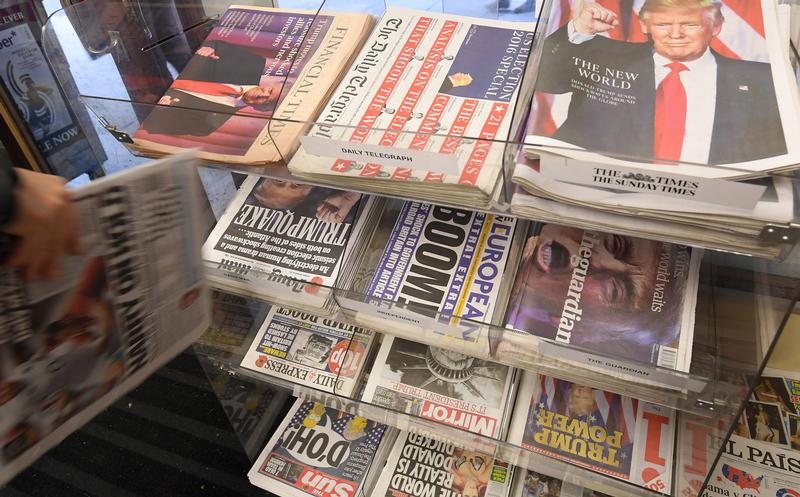 British newspapers are seen with their reaction to the story of U.S. President-elect Donald Trump at a corner shop in London, Britain, November 10, 2016. REUTERS/Toby Melville