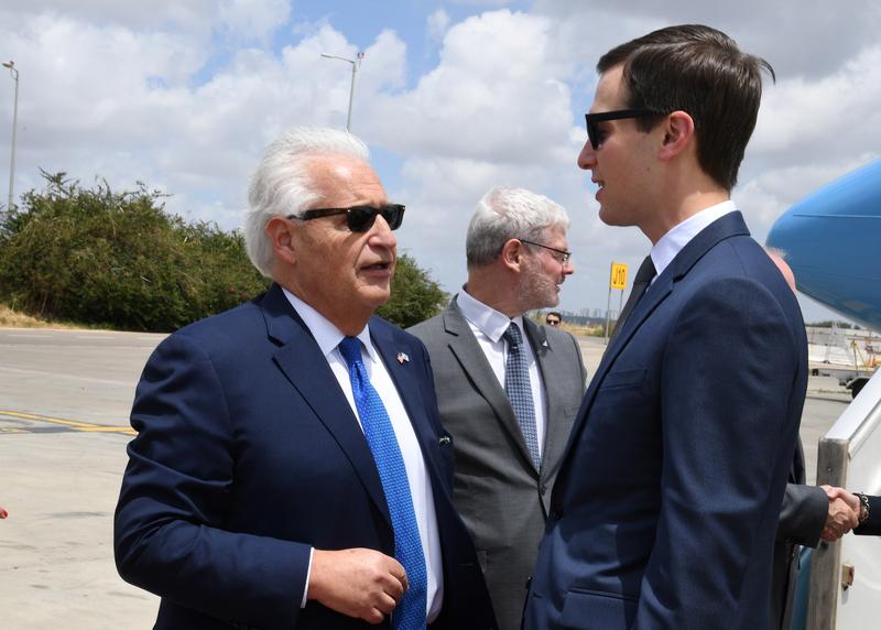 White House Senior Advisor Jared Kushner speaks with U.S. Ambassador to Israel David Friedman upon Kushner's arrival at the Ben Gurion International Airport, near Lod, Israel May 13, 2018. Courtesy David Azagury/U.S. Embassy Tel Aviv/Handout via REUTERS