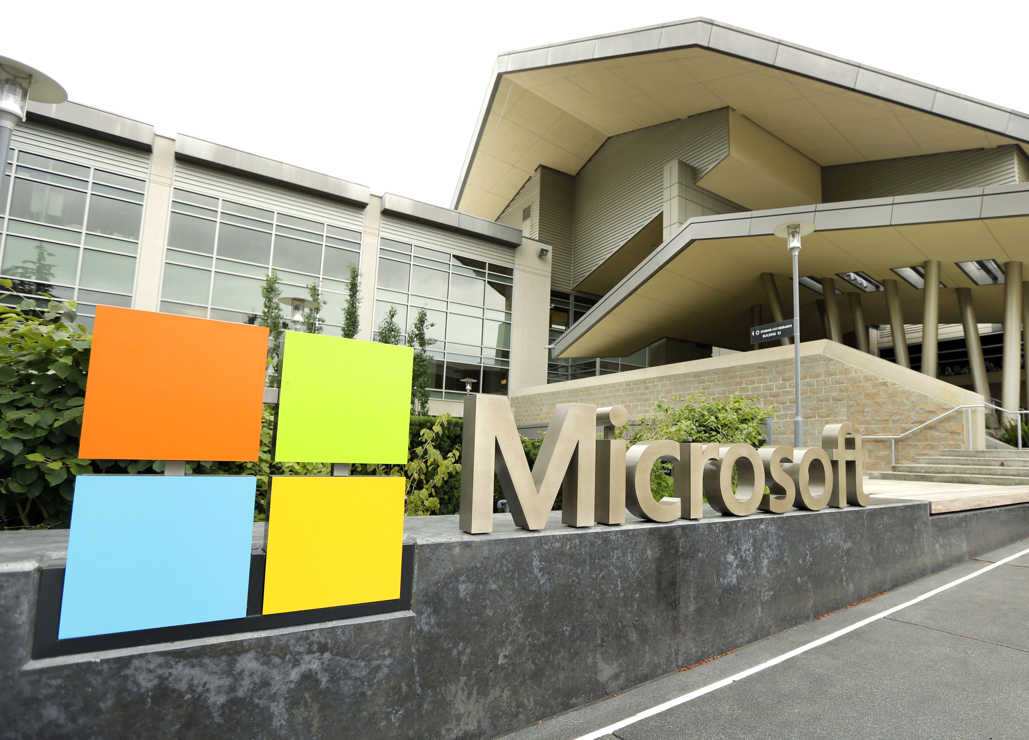 FILE - This July 3, 2014 file photo shows Microsoft Corp. signage outside the Microsoft Visitor Center in Redmond, Wash. (AP Photo Ted S. Warren, File)