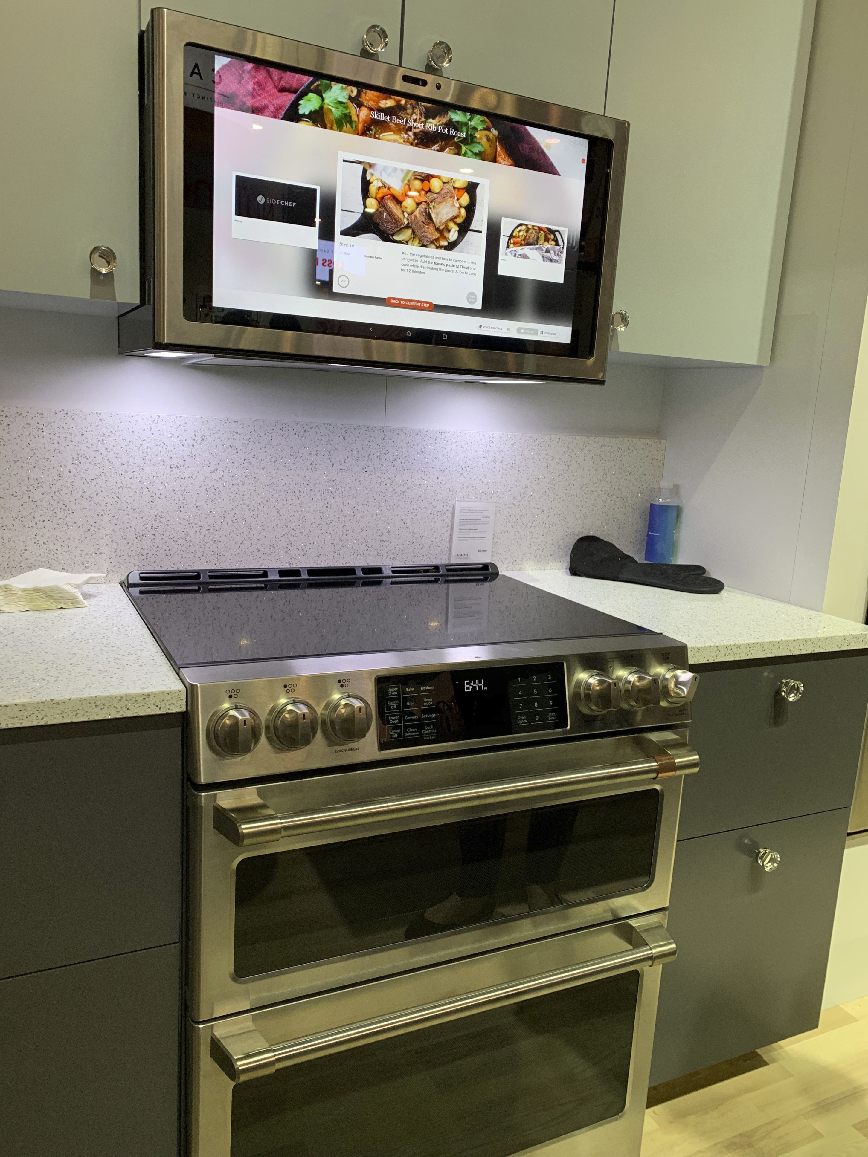 This Feb. 23, 2019 photo shows the GE Profile Kitchen Hub. The vent hood also works as touchscreen or voice-assistant tablet. Built-in cameras let the cook post food or video of what's on the stove, or in front of the hood. (Karen Schwartz via AP)