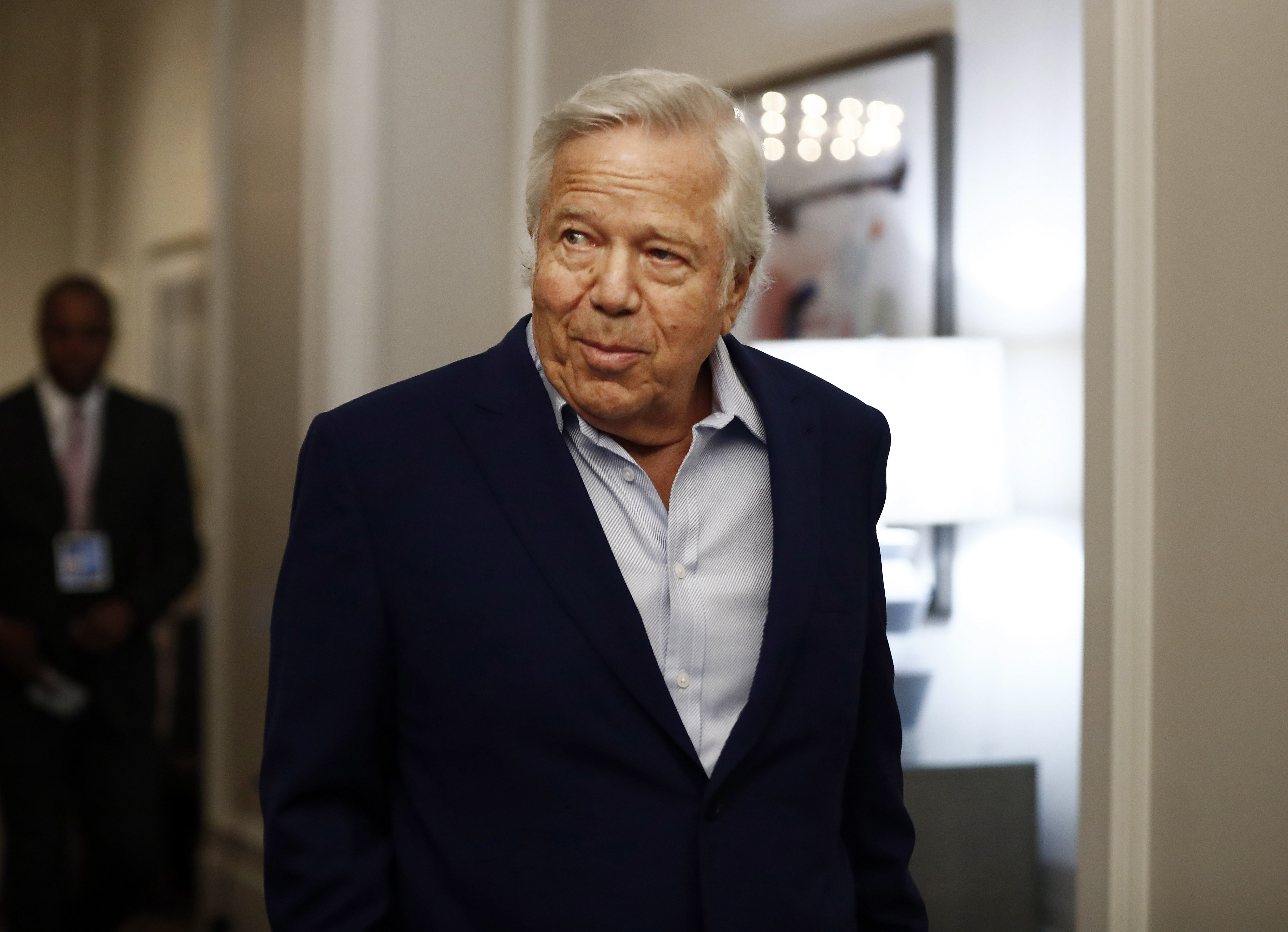 FILE - In this Wednesday, May 22, 2019 file photo, New England Patriots owner Robert Kraft arrives to the NFL football owners meeting in Key Biscayne, Fla.(AP Photo/Brynn Anderson, File)