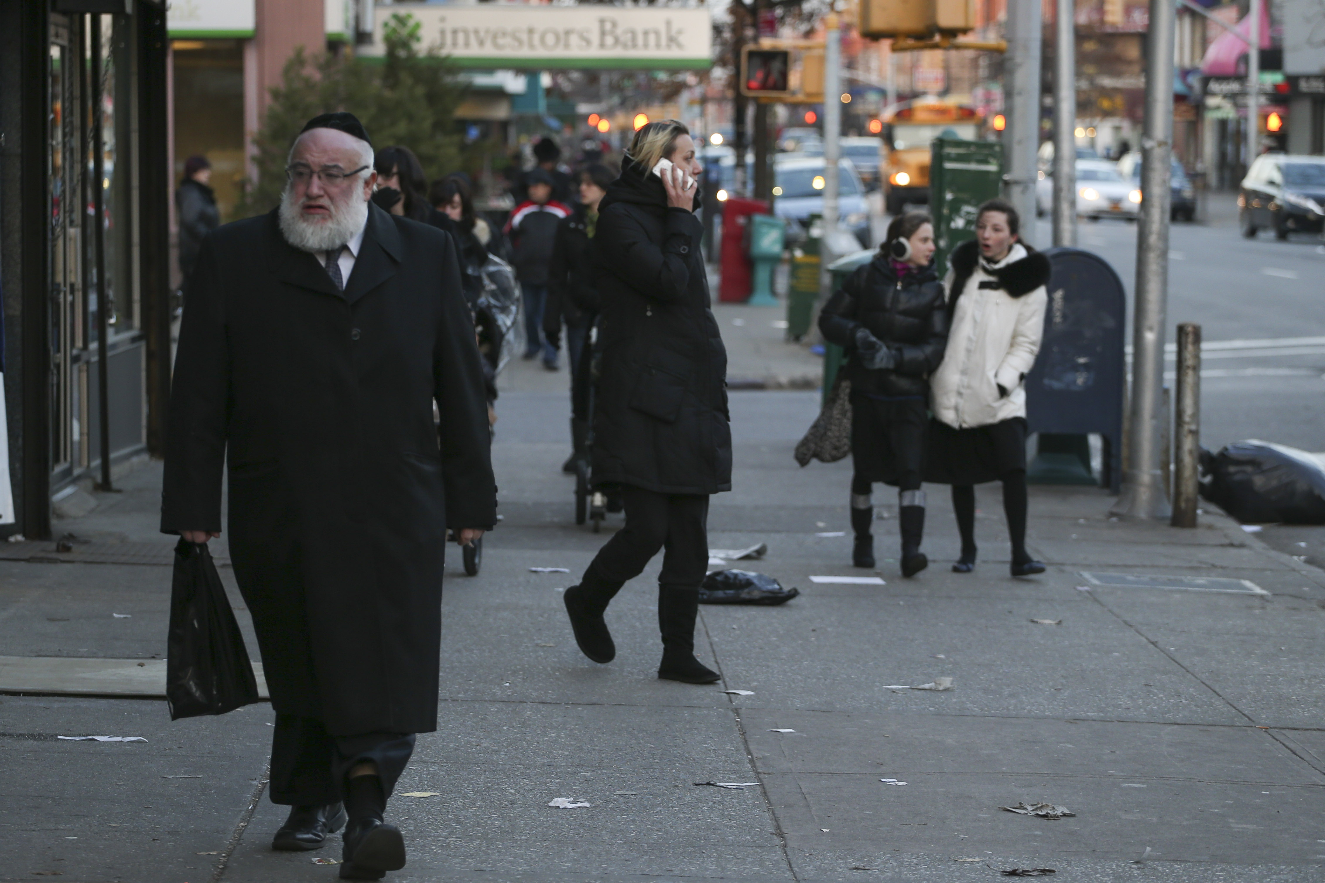 FILE - Ultra Orthodox Jews seen walking on a street in Borough Park neighborhood in the southwestern borough of Brooklyn, New York City. Flash90