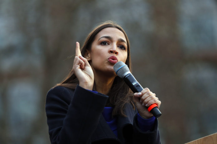 FILE - In this March 8, 2020, file photo Rep. Alexandria Ocasio-Cortez, D-NY., speaks at a campaign rally for then-Democratic presidential candidate Sen. Bernie Sanders, I-Vt., in Ann Arbor, Mich. Now it’s Ocasio-Cortez’s turn to defend her record and battle accusations that she’s lost touch with her district. In 2018, the New York Democrat ousted a veteran lawmaker in a primary. Now, the 30-year-old democratic socialist faces a primary challenge from a former Republican who says Ocasio-Cortez is a celebrity who isn't paying enough attention to her district in the Bronx and Queens(AP Photo/Paul Sancya, File)
