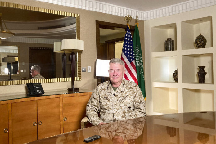 Marine Gen. Frank McKenzie, top U.S. commander for the Middle East, speaks to reporters traveling with him in Riyadh, Saudi Arabia, on Sunday, May 23, 2201. “The Middle East writ broadly is an area of intense competition between the great powers. And I think that as we adjust our posture in the region, Russia and China will be looking very closely to see if a vacuum opens that they can exploit,” he says. (AP Photo/Lolita Baldor)