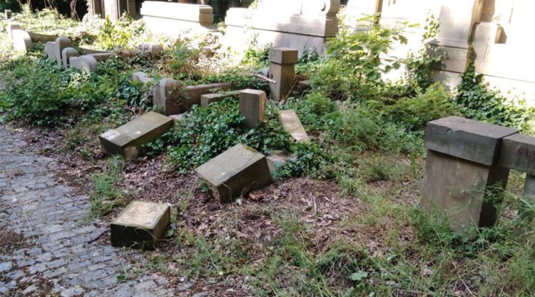 Toppled and smashed headstones lie scattered at the Jewish Cemetery of Wroclaw, Poland, June 16, 2021. (The Jewish Community of Wroclaw)