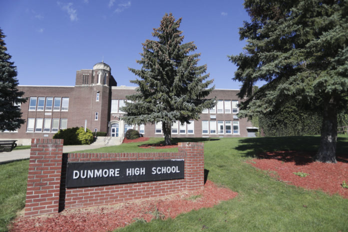 This Sept. 2021 photo shows Dunmore High School in Dunmore, Pa. Four teenagers have been charged with a plot to attack a Pennsylvania high school in 2024, on the 25th anniversary of the massacre at Colorado's Columbine High School, authorities said, Friday, Sept. 24, 2021. A 15-year-old girl and 15-year-old boy are charged as adults and two other teenagers face juvenile charges in the plan to attack Dunmore High School, outside Scranton, on April 20, 2024, authorities said. (Jake Danna Stevens/The Times-Tribune via AP)