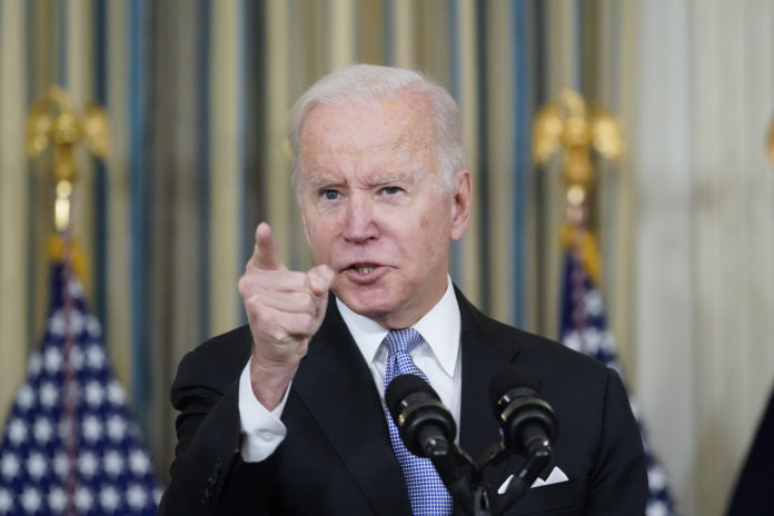 President Joe Biden responds to a question about the U.S. border as he speaks in the State Dinning Room of the White House, Saturday, Nov. 6, 2021, in Washington. (AP Photo/Alex Brandon)