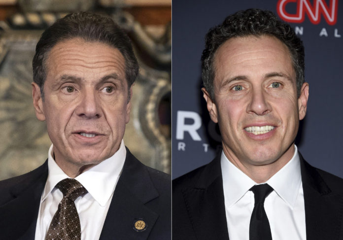 FILE - In this combination of photos New York Gov. Andrew Cuomo, left, appears during a news conference about COVID-19 at the State Capitol in Albany, N.Y., on Dec. 3, 2020, and his brother CNN anchor Chris Cuomo attends the 12th annual CNN Heroes: An All-Star Tribute at the American Museum of Natural History in New York on Dec. 9, 2018. CNN said Tuesday, Nov. 30, 2021, it was suspending Chris Cuomo indefinitely after details emerged about how he helped his brother, as he faced charges of sexual harassment.(Mike Groll/Office of Governor of Andrew M. Cuomo via AP, left, and Evan Agostini/Invision/AP, File)
