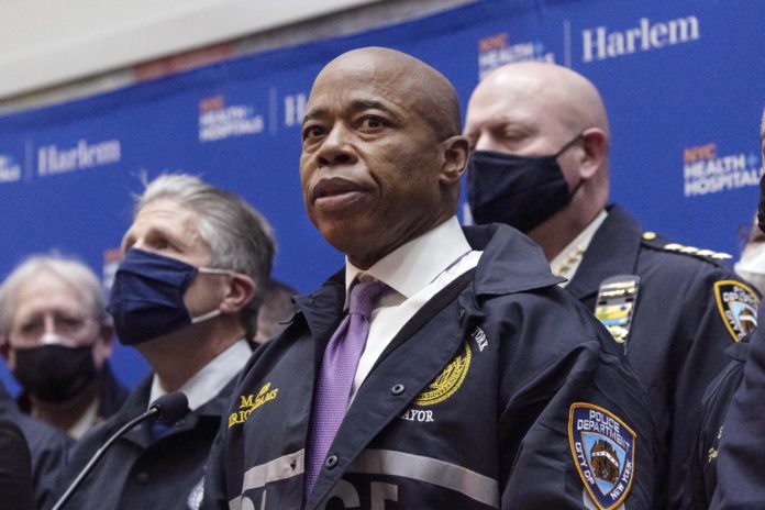 FILE — New York Mayor Eric Adams speaks during the press conference at Harlem Hospital after the shooting of a New York City Police Department officer, in Harlem, Friday, Jan. 21, 2022, in New York. Adams is set to propose Wednesday, April 20, that the city spend $4.8 million to reach out to those most impacted by the so-called war on drugs. (AP Photo/Yuki Iwamura File)