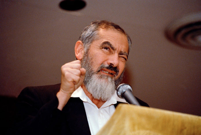 Leader and co-founder of the Jewish Defense League, Brooklyn-born Meir Kahane, addresses a gathering at the Silver Springs Jewish Center in Maryland, Oct. 27, 1988, a day after a federal judge ruled that Kahane could travel to the U.S. from Israel for a speaking tour. (AP Photo/Doug Mills)