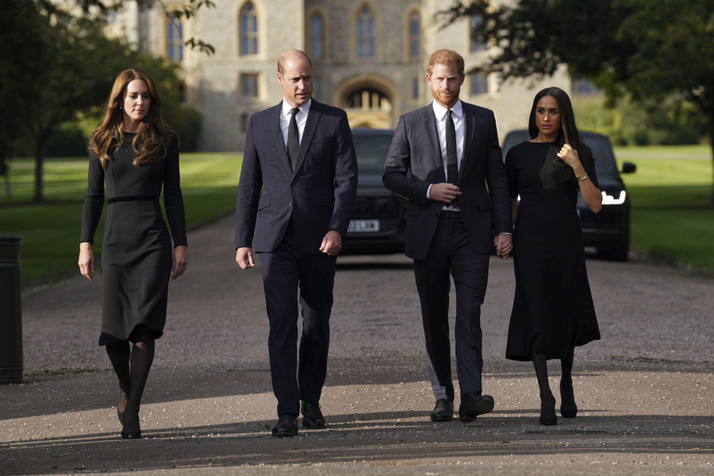 From left, Britain’s Kate, Princess of Wales, Prince William, Prince of Wales, Prince Harry and Meghan walk to meet members of the public, at Windsor Castle, following the death of Queen Elizabeth II on Thursday, in Windsor, England, Saturday, Sept. 10, 2022. (Kirsty O’Connor/Pool Photo via AP)