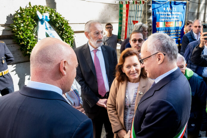 Rome Mayor Roberto Gualtieri, right, President of the Jewish Community of Rome Ruth Dureghello, second from right, and Rome's Chief Rabbi Riccardo Di Segni, center, attend a ceremony outside the Synagogue on the occasion of 79th anniversary of the Nazis deportation of Roman citizens of Jewish religion, in Rome, Sunday, Oct. 16, 2022. On Oct. 16, 1943, German occupation soldiers gathered more than 1,000 Jewish men, women and children from their homes in the Roman Ghetto and deported them to Auschwitz. (Mauro Scrobogna/LaPresse via AP)