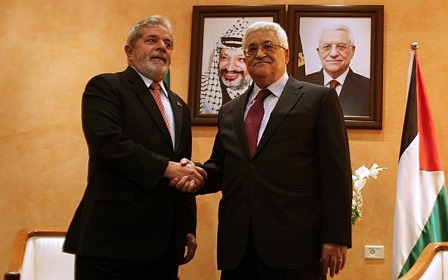 FILE - Then-Brazilian president Luiz Inacio Lula da Silva, left, shakes hands with Palestinian Authority leader Mahmoud Abbas during a welcome ceremony at the Palestinian Authority headquarters in the West Bank city of Bethlehem, on March 16, 2010. (AP Photo/Musa al-Shaer, pool)