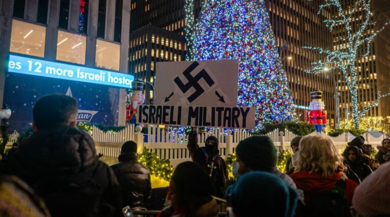 Protesters Brandish Swastikas at Pro-palestinian Rally Outside Rockefeller Center X-mas Tree Lighting | SOURCE: VINnews