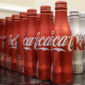 This March 7, 2015 photo shows 8.5 ounce bottles of Coca-Cola at the Cadillac Championship golf tournament in Doral, Fla. Coca-cola, which struggles with declining soda consumption in the U.S., is working with fitness and nutrition experts who suggest its cola as a healthy treat. (AP Photo/Wilfredo Lee)